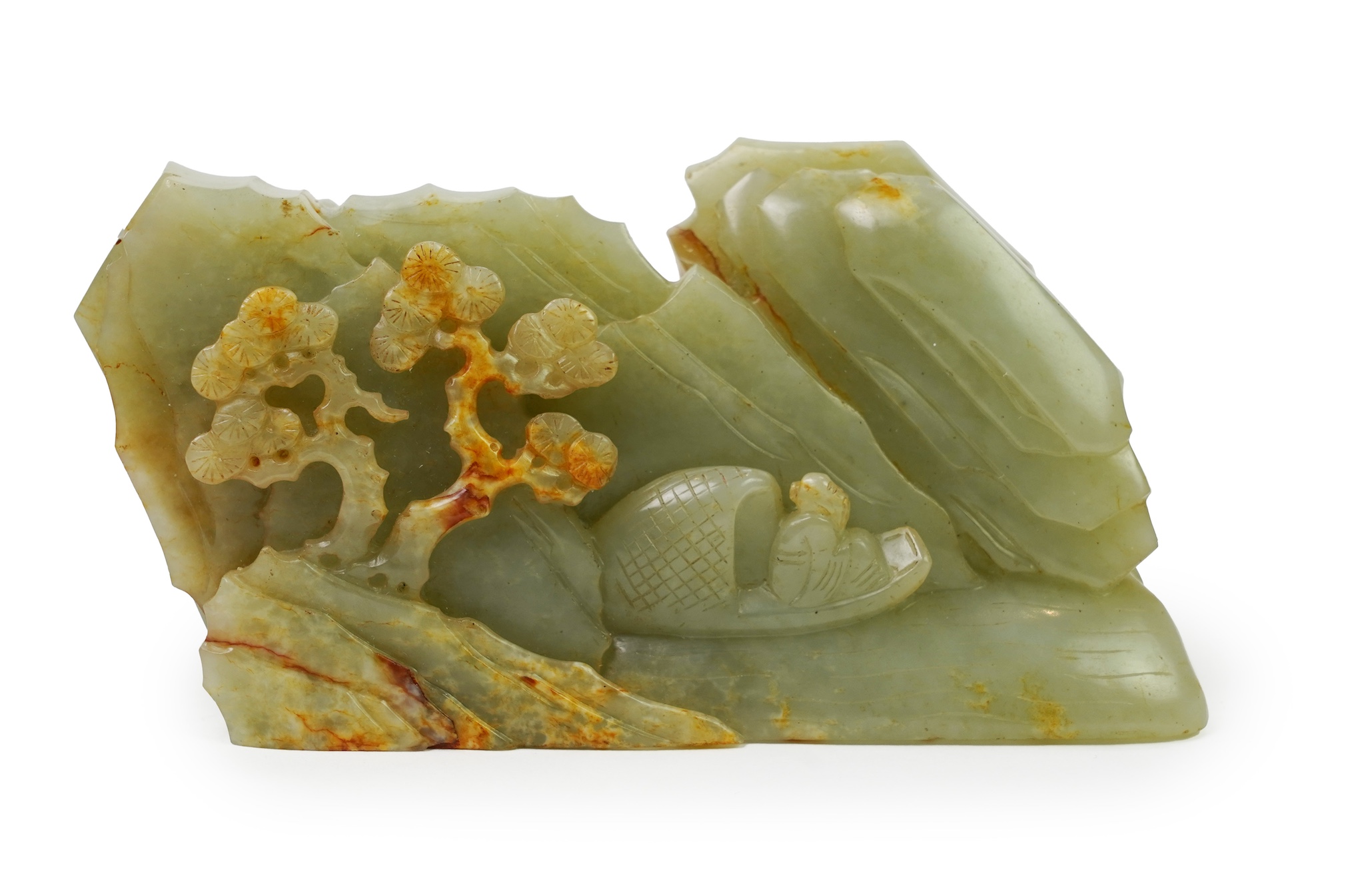A Chinese celadon and russet jade boulder carving